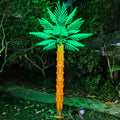 2.5m (8.2ft) LED palm tree light in a garden, green leaves with warm trunk glow for backyard decor