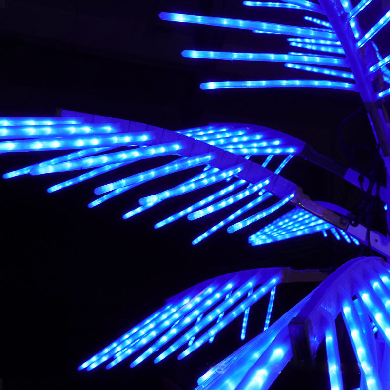 Warm LED icicle lights for trees.Close-up detail of LED palm tree light leaves and structure, 3m model with 12 leaves for long-term outdoor use