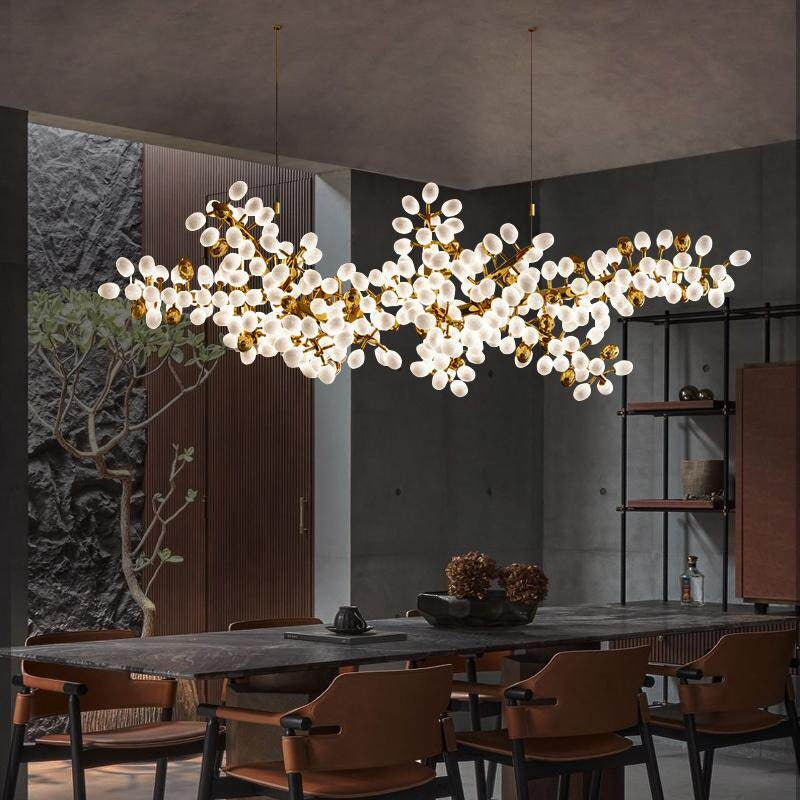 Close-up of white glass shades on organic chandelier