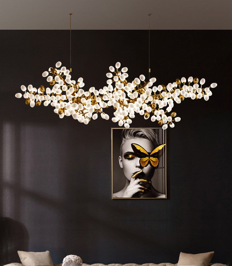 Organic white glass cluster chandelier hanging in a modern dining room