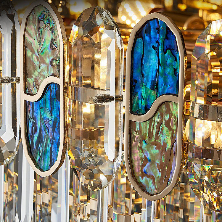 Close-up of blue abalone glass and crystal on chandelier