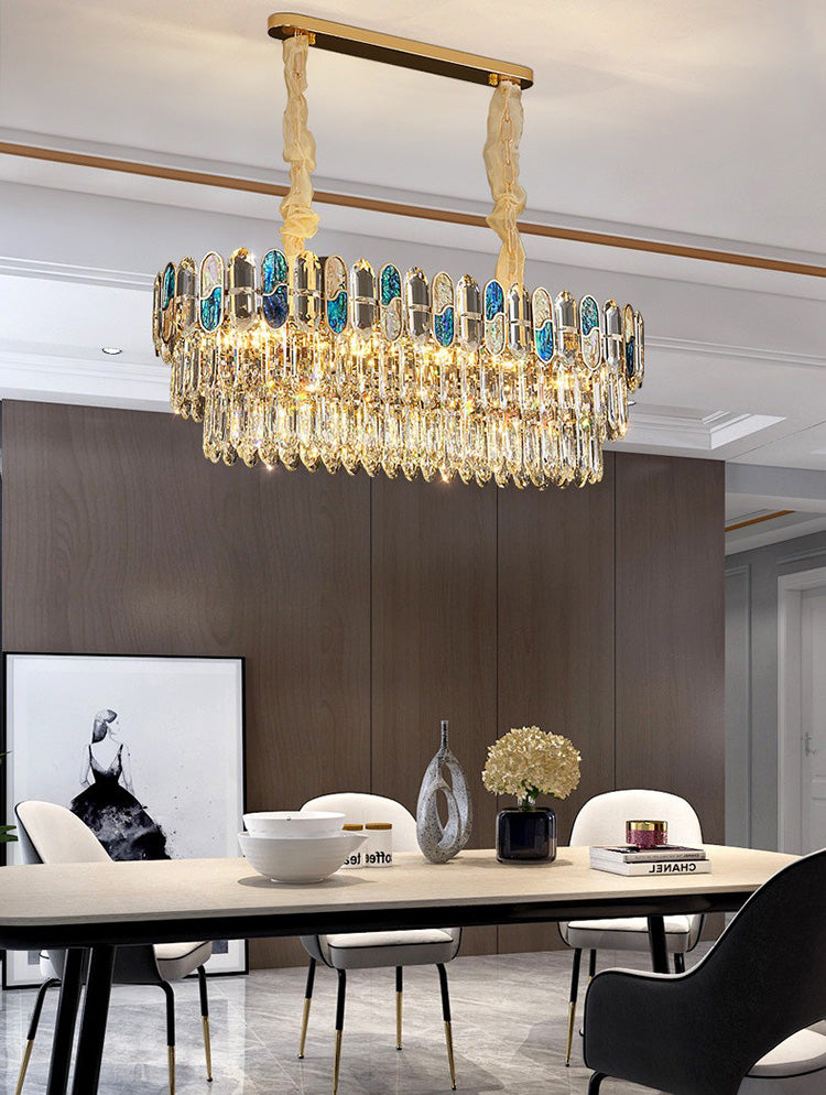 Blue abalone glass crystal chandelier above dining table in modern interior