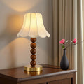 French floral fabric table lamp on wooden cabinet in modern interior