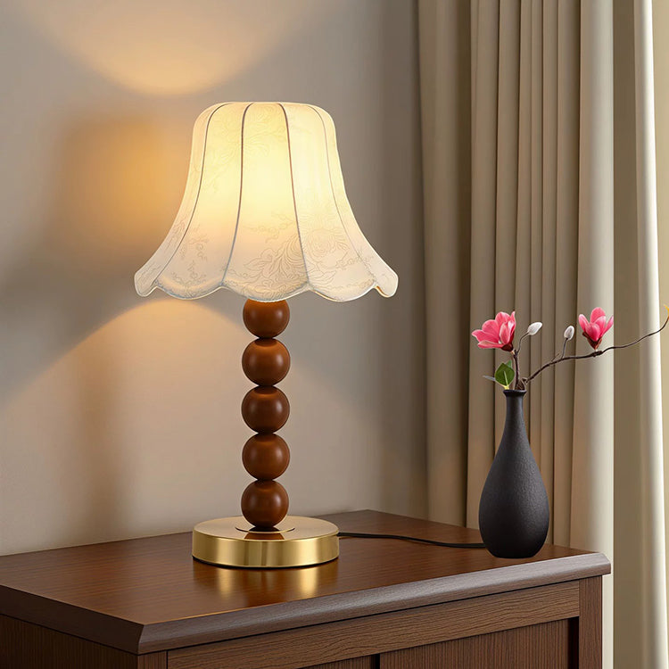 French floral fabric table lamp on wooden cabinet in modern interior