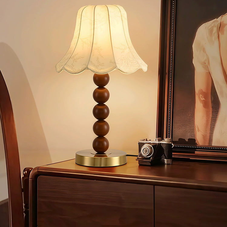 French floral fabric table lamp on dresser in warm interior