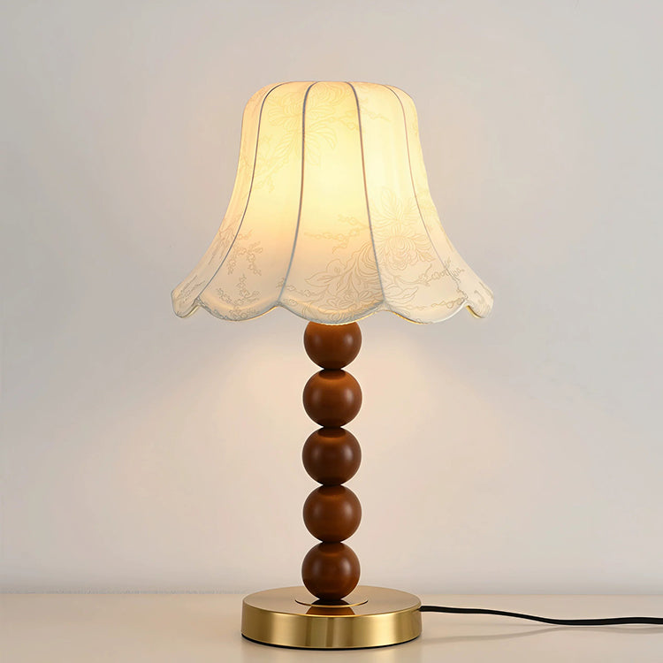 French floral fabric table lamp lit on white background