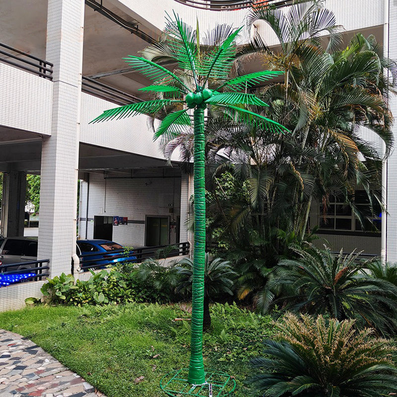 LED palm tree light installed in a villa garden landscape, realistic trunk and bright leaves