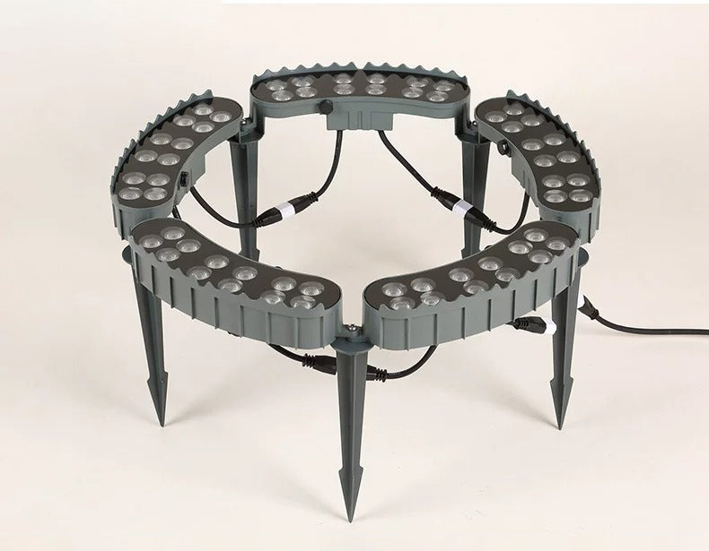 Unlit five-head LED tree ring uplight showing the grey housings, LED lenses, connecting cables and ground spikes.