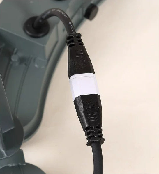 Close-up of the cable connector and wiring between LED tree ring uplight lamp heads.