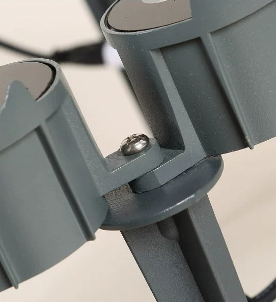 Close-up of the LED tree ring uplight housing joint and screw fixing above the ground spike.