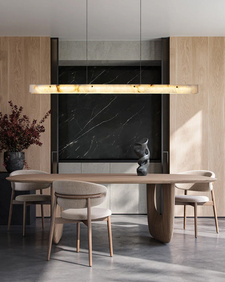 Modern dining room with suspended linear alabaster pendant light