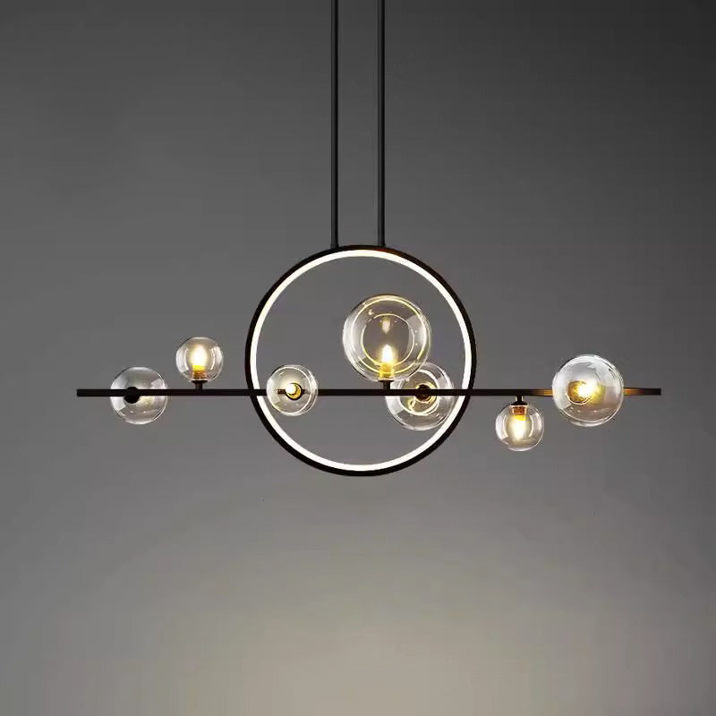 Nordic glass ball chandelier hanging above dining table in modern interior