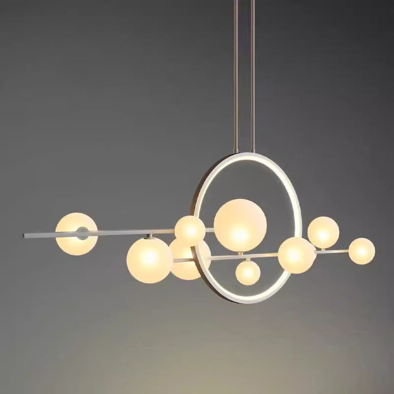 Nordic glass ball chandelier hanging above dining table in modern interior