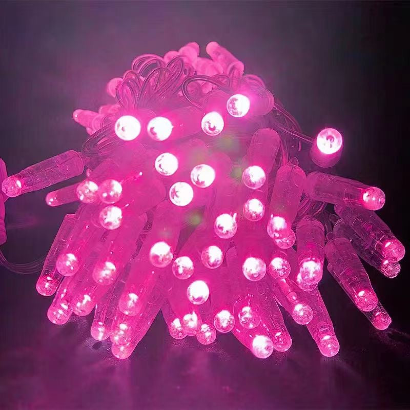Pink PVC LED string light close up with clear wire