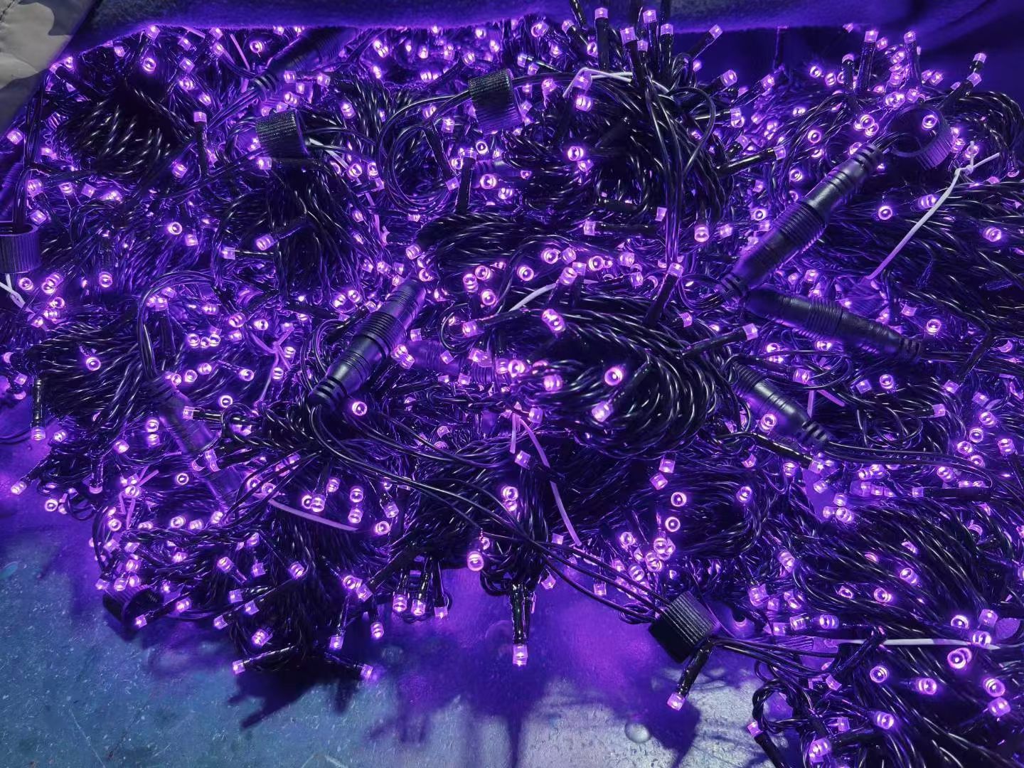 Purple PVC LED string lights with black wire and waterproof connectors