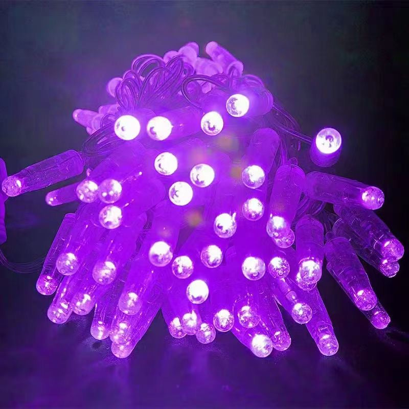 Purple PVC LED string light close up with clear wire
