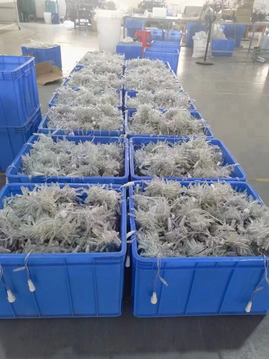 Clear wire PVC LED string lights packed in factory production bins