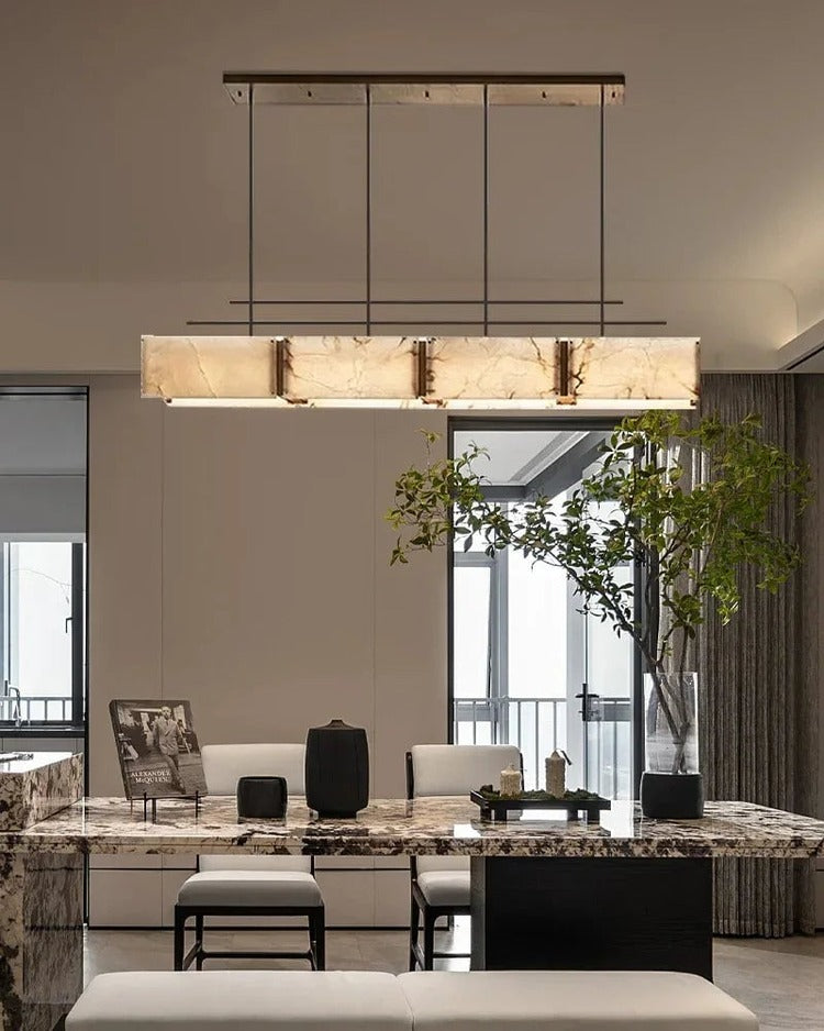 Rectangular alabaster brass chandelier above modern kitchen island