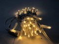 Outdoor rubber wire LED string lights with warm white LEDs and white wire connectors