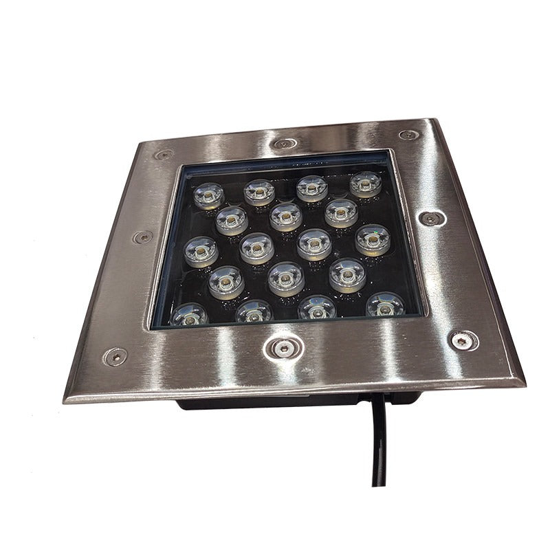 Square stainless steel LED in-ground light close up for outdoor landscape lighting