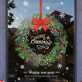 Traditional Christmas wreath static window cling with red bow, pine branches and berries