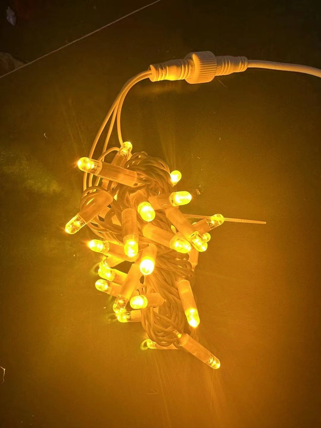 Warm white rubber wire LED string lights with waterproof connector