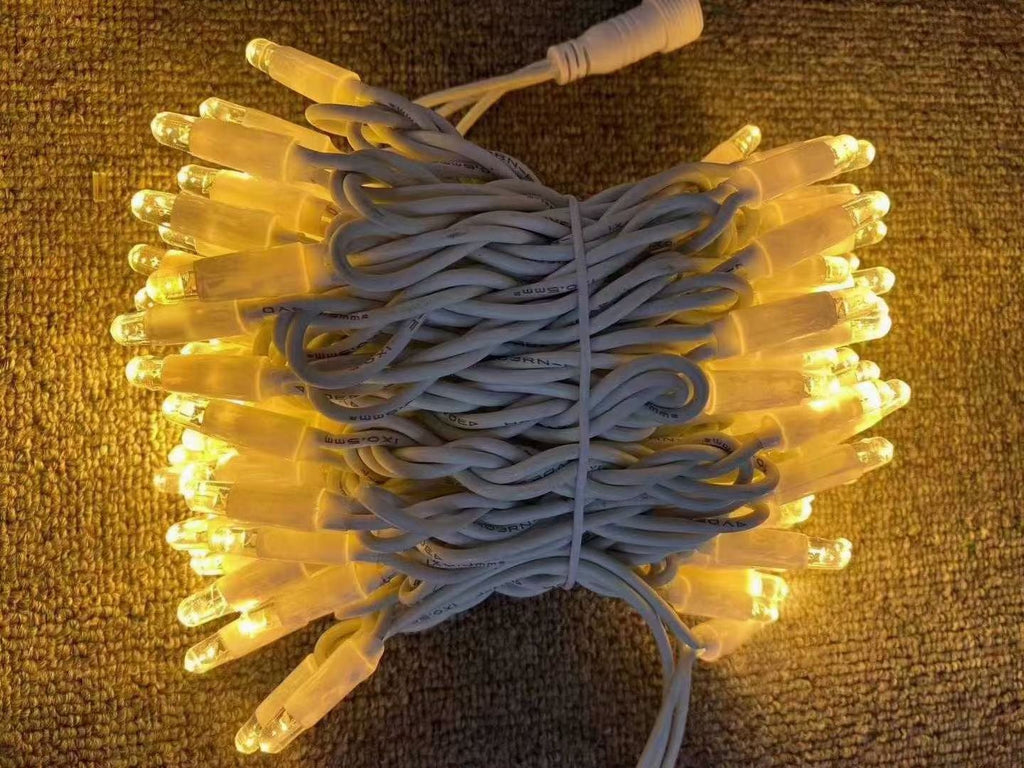 Warm white rubber wire LED string lights with white wire bundled
